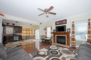 Formal dining room with hardwood floors and built-in shelves.