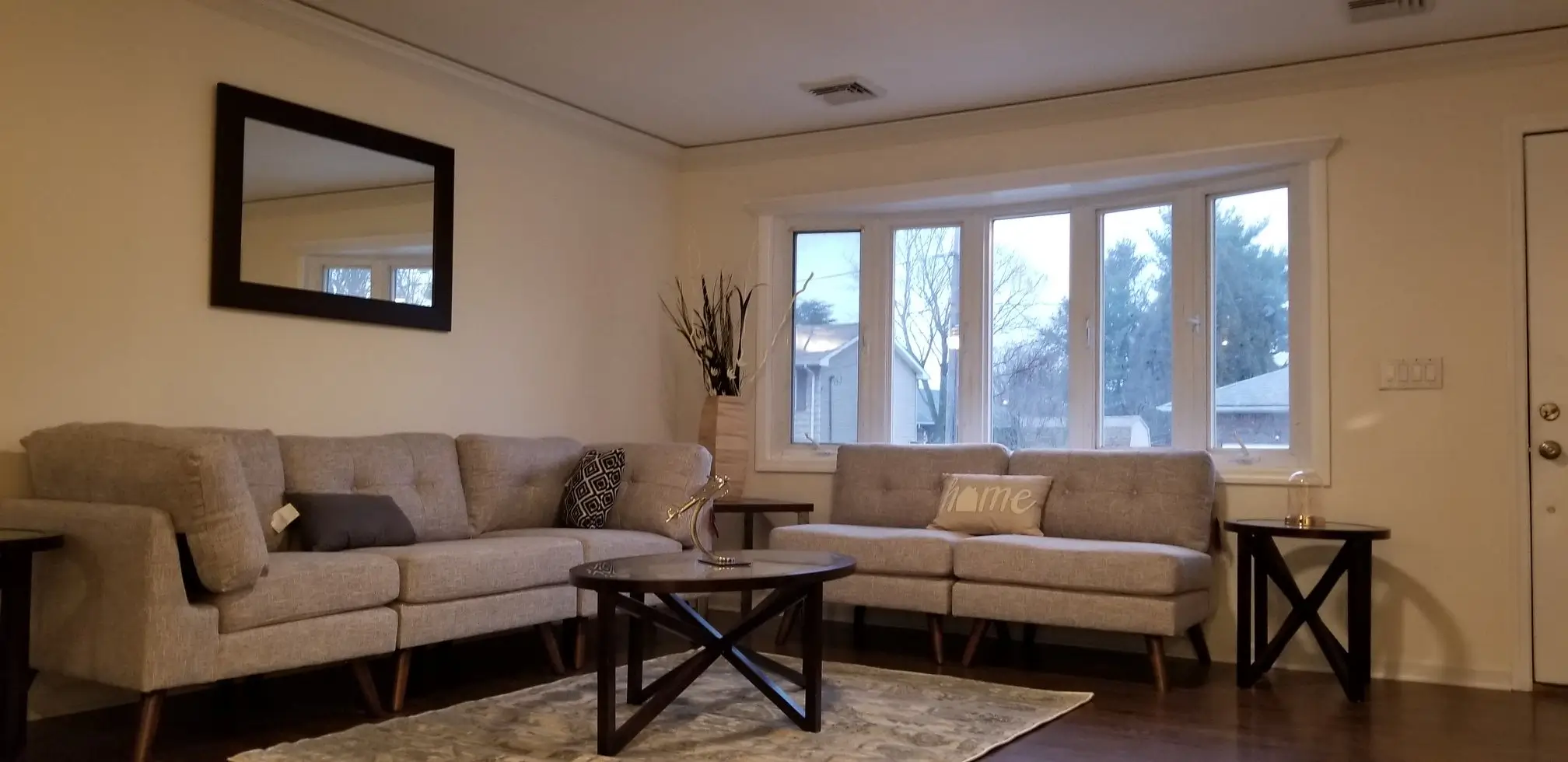 Bright living room with gray sofas and coffee table