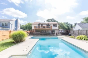 Blue pool in a backyard