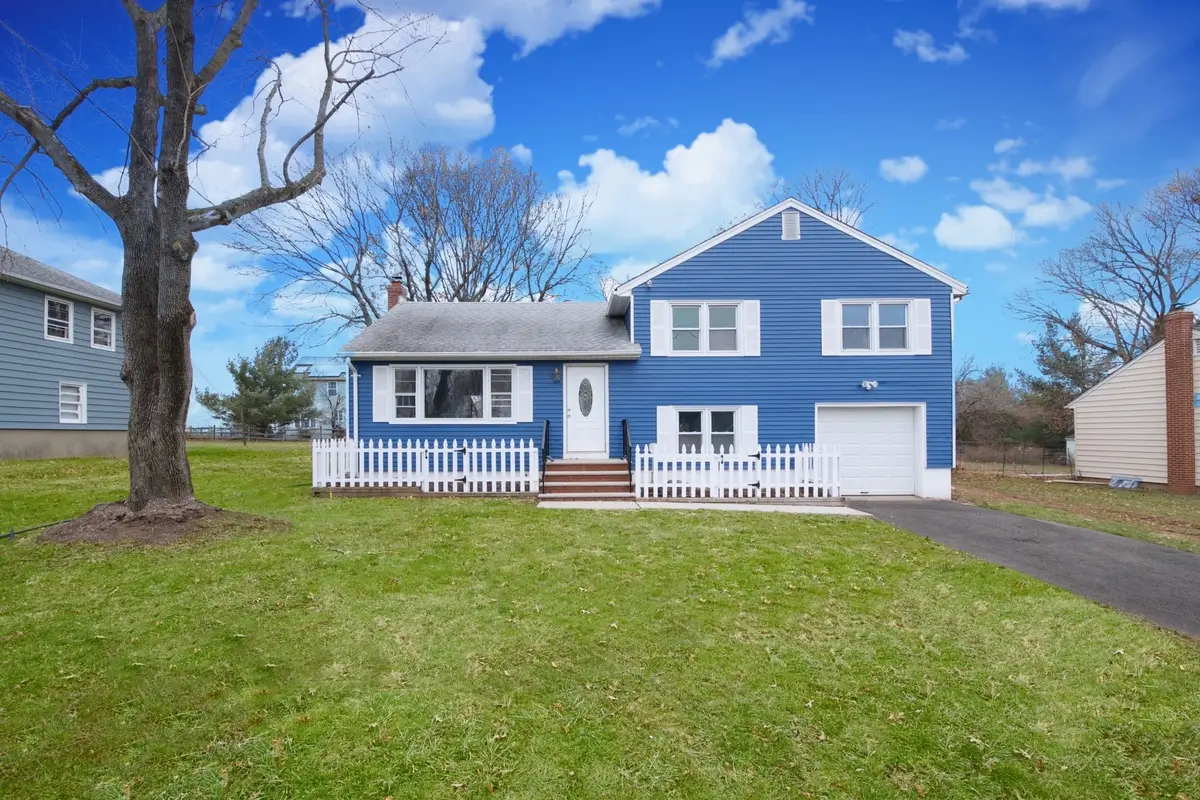 Blue house with white fence