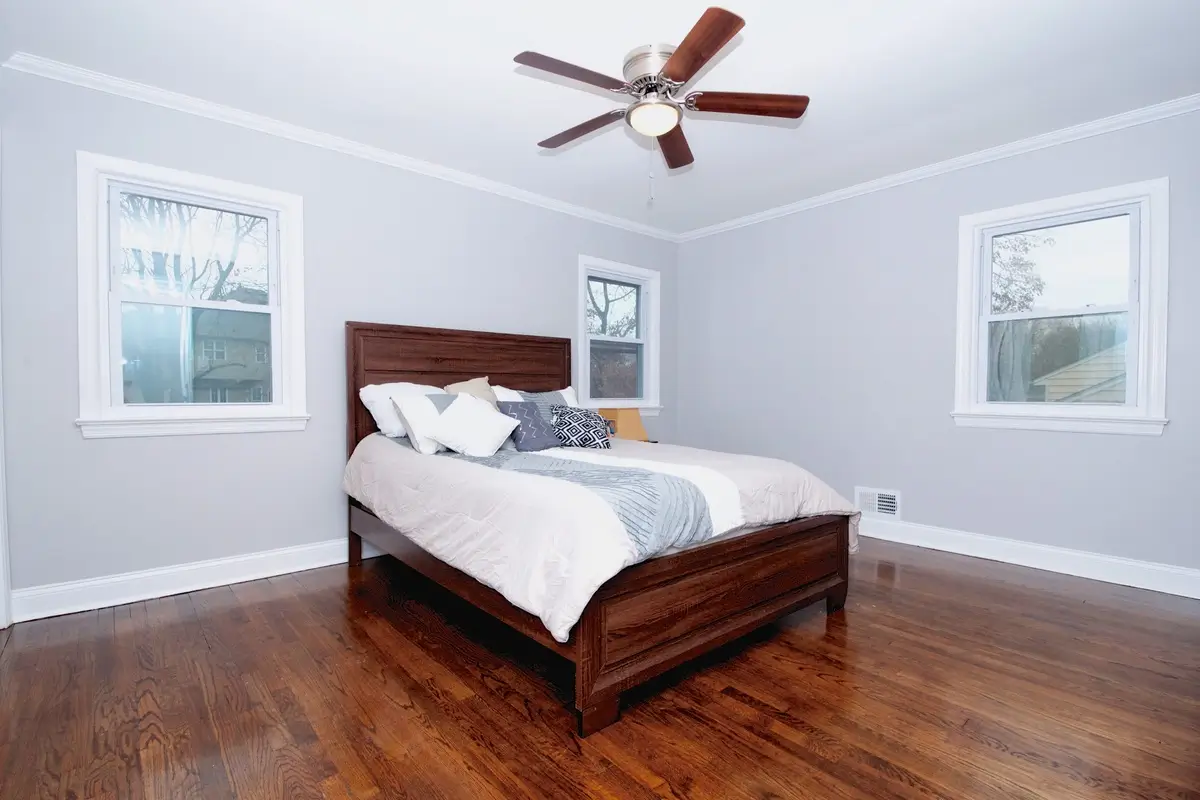 Bedroom with dark wood bed