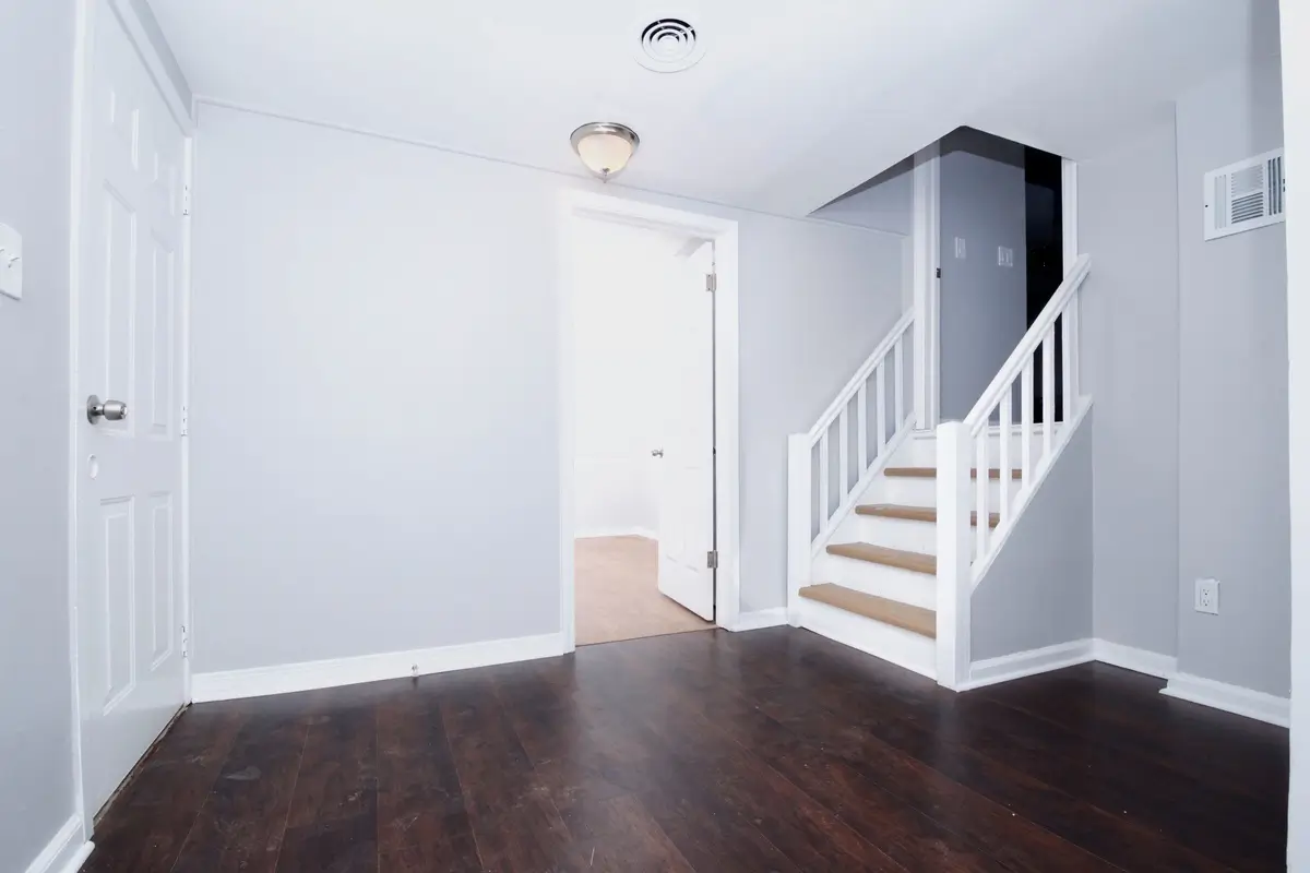 Hallway with dark wood floor