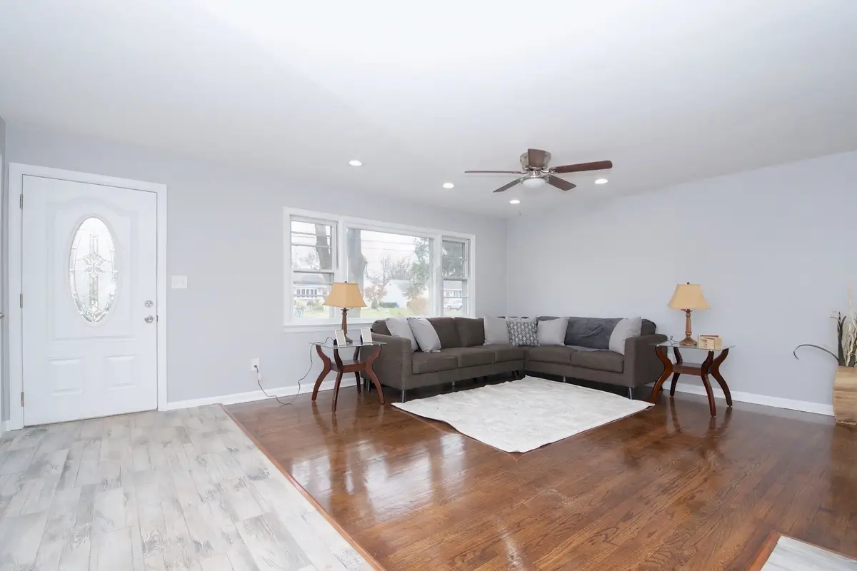 Bright living room with gray sofas