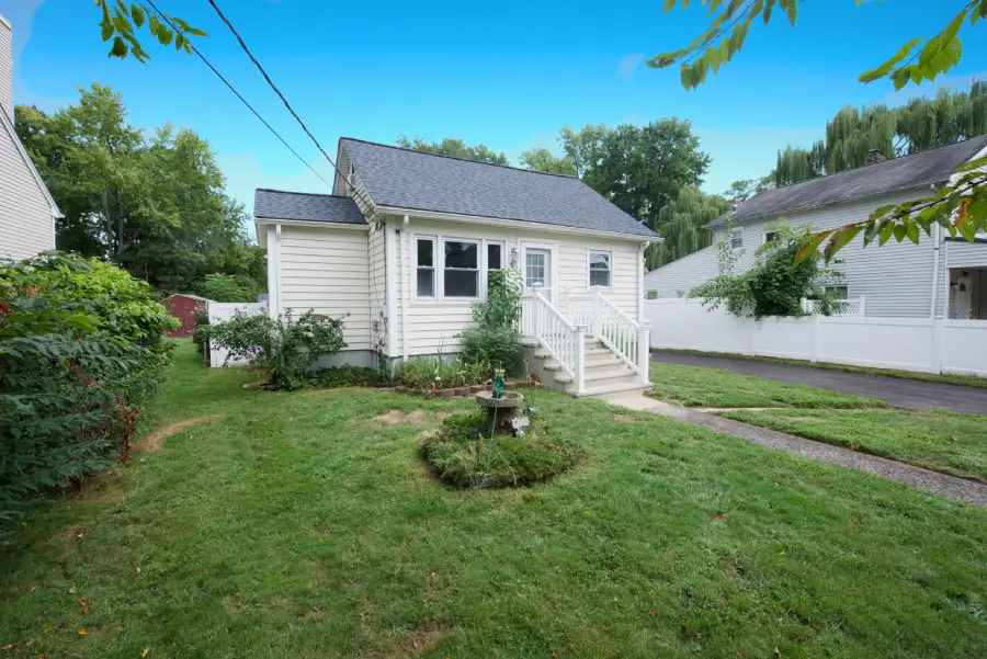 Single-story house with a gray roof and white siding