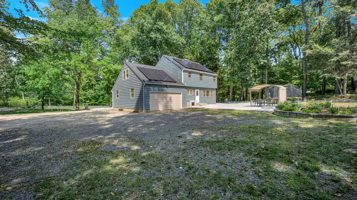 Blue house with ample vegetation around