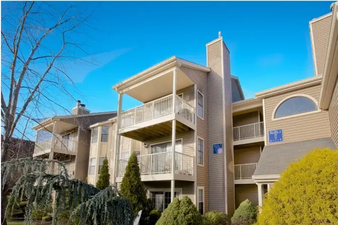 Balconies with white railings in multi-store apartment building