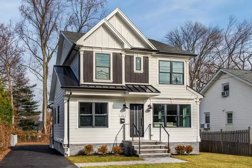 Modern two-story house with white and dark brown siding