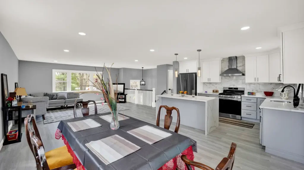 Open-concept living space that includes a kitchen, dining area, and living room