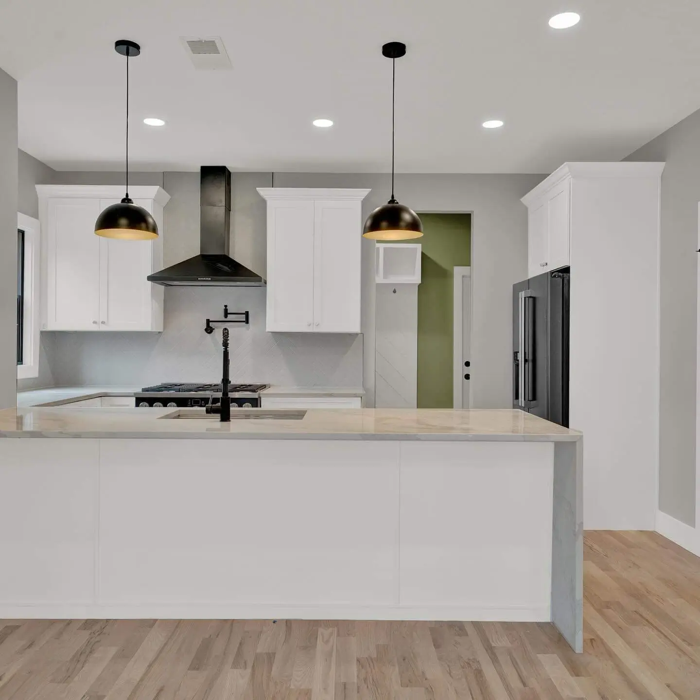 Minimalist kitchen with white island