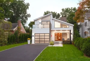 Modern white house with excellent open space and large windows.